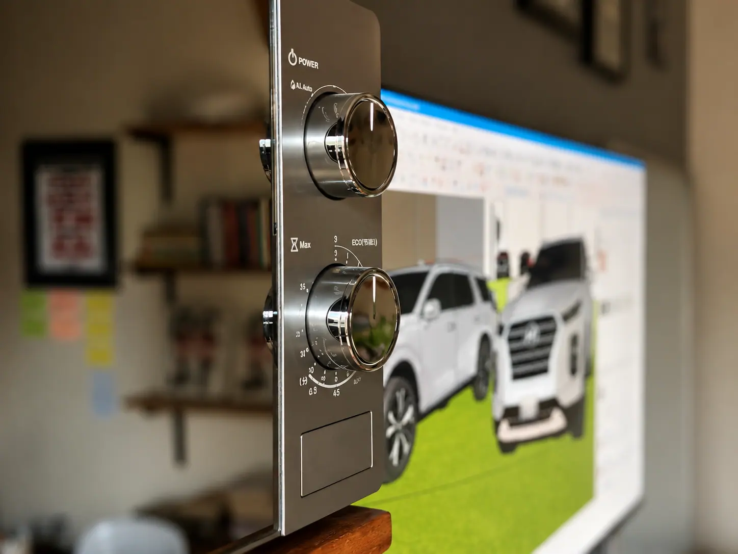 Details at the office beside a screen showing a 3D design