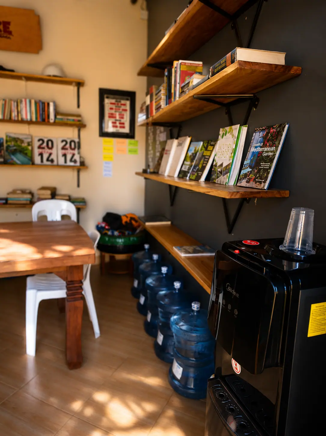 Books and a meeting table inside the Eco MICE design office