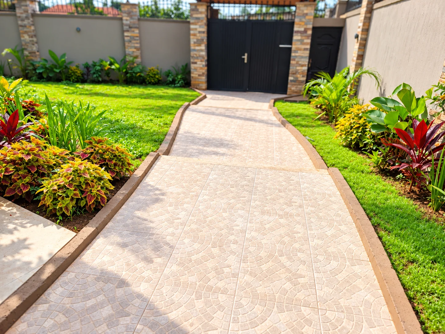Grass and planted borders on both sides of the tiled entrance path at Rubaga.